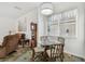 Bright dining space showcasing a glass-top table, and natural light, perfect for enjoying meals at 6239 French Creek Ct, Ellenton, FL 34222