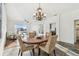 Bright and airy dining area with a chandelier and a table with seating for four people at 6239 French Creek Ct, Ellenton, FL 34222