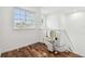 Upstairs landing area featuring window, hardwood floors and stair lift at 6239 French Creek Ct, Ellenton, FL 34222