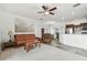 Open-concept living room with comfortable seating and an open view into the kitchen area at 6239 French Creek Ct, Ellenton, FL 34222