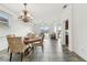 Open-concept living and dining area with natural light and seamless access to the outdoor patio at 6239 French Creek Ct, Ellenton, FL 34222