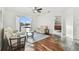 Cozy living room with a ceiling fan, comfortable seating, and sliding glass doors to the outdoors at 6239 French Creek Ct, Ellenton, FL 34222