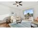 Bright and airy living room with comfortable seating and a sliding glass door leading to an outdoor patio at 6239 French Creek Ct, Ellenton, FL 34222