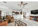 Spacious living room with comfortable seating and an open view into the kitchen and dining area at 6239 French Creek Ct, Ellenton, FL 34222