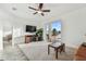 Bright living room features a ceiling fan and sliding doors that lead to a beautiful backyard pool area at 6239 French Creek Ct, Ellenton, FL 34222