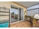 The outdoor grilling and dining area features a stainless steel grill, sink, and bar seating at 6239 French Creek Ct, Ellenton, FL 34222