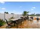The outdoor patio provides a great space to relax and unwind with seating and beautiful pond views at 6239 French Creek Ct, Ellenton, FL 34222