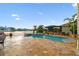 Beautiful backyard pool area features a spa and lush landscaping, perfect for relaxing and entertaining at 6239 French Creek Ct, Ellenton, FL 34222