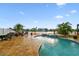 Beautiful backyard pool area features a spa and lush landscaping, perfect for relaxing and entertaining at 6239 French Creek Ct, Ellenton, FL 34222