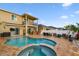 Backyard features a pool and outdoor kitchen for easy outdoor entertaining at 6239 French Creek Ct, Ellenton, FL 34222