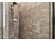 Tiled shower stall with showerhead and built-in soap dish at 6239 French Creek Ct, Ellenton, FL 34222