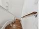 Wooden staircase with white trim and handrail leading upstairs in a well-lit home at 6239 French Creek Ct, Ellenton, FL 34222