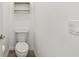 Neutral bathroom with a toilet and a small shelf at 6239 French Creek Ct, Ellenton, FL 34222