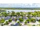 Stunning aerial view of a home near a lake with lush greenery and well-maintained neighborhood at 6423 Seasound Dr, Apollo Beach, FL 33572