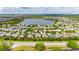 Expansive aerial view of a lakeside community showcasing homes and beautiful landscaping at 6423 Seasound Dr, Apollo Beach, FL 33572