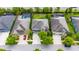 Aerial view of a well-maintained property with a manicured lawn, mature trees, and a driveway at 6423 Seasound Dr, Apollo Beach, FL 33572
