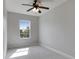 A cozy bedroom featuring a ceiling fan and natural light, creating a comfortable and inviting space to unwind and rest at 6423 Seasound Dr, Apollo Beach, FL 33572