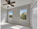 A bright bedroom with multiple windows allowing ample natural light and a spacious closet at 6423 Seasound Dr, Apollo Beach, FL 33572