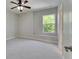 Bedroom featuring carpet, a ceiling fan, and a window at 6423 Seasound Dr, Apollo Beach, FL 33572