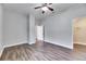 Spacious bedroom with ample closet space, hardwood floors, and neutral walls at 6423 Seasound Dr, Apollo Beach, FL 33572