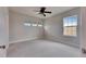 Bedroom with carpet, a ceiling fan, and a window with blinds at 6423 Seasound Dr, Apollo Beach, FL 33572