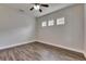 Minimalist bedroom featuring sleek floors, natural light, and a clean, modern aesthetic at 6423 Seasound Dr, Apollo Beach, FL 33572