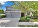Two-story home features a three-car garage, well-maintained landscaping, and a classic design at 6423 Seasound Dr, Apollo Beach, FL 33572