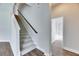 Hallway featuring stairs and a bathroom with white walls and natural light at 6423 Seasound Dr, Apollo Beach, FL 33572