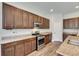 Well-equipped kitchen featuring stainless steel appliances, granite countertops, and ample cabinet space at 6423 Seasound Dr, Apollo Beach, FL 33572