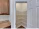 Walk-in pantry providing ample storage space with white wire shelving and easy access at 6423 Seasound Dr, Apollo Beach, FL 33572