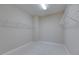 A well-organized walk-in closet with ample shelving for efficient storage and a clutter-free lifestyle in the home at 6423 Seasound Dr, Apollo Beach, FL 33572