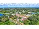 Aerial view of entire property bordered in red, with various trees and lush landscape at 6501 62Nd N St, Pinellas Park, FL 33781