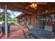 Spacious back porch featuring outdoor dining area with wooden floors and ceiling, perfect for relaxing and entertaining at 6501 62Nd N St, Pinellas Park, FL 33781