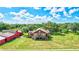 Charming house with lush green lawn, mature trees, and picturesque surroundings for peaceful living at 6501 62Nd N St, Pinellas Park, FL 33781