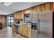 This kitchen has stainless steel appliances, a double sink, and an adjacent dining area at 6501 62Nd N St, Pinellas Park, FL 33781