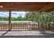 Wooden patio with a picturesque view of an adjacent garden and fence, providing a serene outdoor space at 6501 62Nd N St, Pinellas Park, FL 33781
