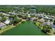 Aerial shot of neighborhood, showcasing the lake and green landscape at 7123 Colonial Lake Dr, Riverview, FL 33578