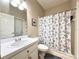 Bathroom featuring a vanity with a white sink and cabinet, toilet and tiled shower and tub combo at 7123 Colonial Lake Dr, Riverview, FL 33578