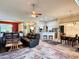 Spacious living room with view of kitchen and dining area, featuring modern furniture and ample seating at 7123 Colonial Lake Dr, Riverview, FL 33578