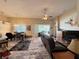 Open concept living room with sliding glass doors leading to outdoor area and adjacent dining space at 7123 Colonial Lake Dr, Riverview, FL 33578