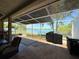Spacious screened patio offering serene lake views, perfect for outdoor relaxation and entertainment at 7123 Colonial Lake Dr, Riverview, FL 33578