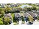 Aerial view of a two-story home with a lawn, garden, and fenced yard at 7653 Stoney Hill Dr, Wesley Chapel, FL 33545