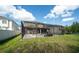 Large backyard with a screened-in pool, brick pavers, and a serene view of the surrounding landscape at 7653 Stoney Hill Dr, Wesley Chapel, FL 33545
