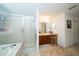 Bright bathroom with glass-enclosed shower and vanity with lots of counter space at 7653 Stoney Hill Dr, Wesley Chapel, FL 33545