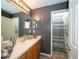 Bathroom featuring gray walls, a long vanity, and a tiled shower and bathtub at 7653 Stoney Hill Dr, Wesley Chapel, FL 33545