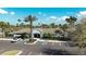 Clubhouse with a parking lot and tropical landscaping at 7653 Stoney Hill Dr, Wesley Chapel, FL 33545