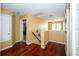 Second floor hallway featuring hardwood floors and a view of the lower floor staircase at 7653 Stoney Hill Dr, Wesley Chapel, FL 33545