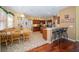 An open concept kitchen provides bar seating, an eat-in area, and access to other rooms in the home at 7653 Stoney Hill Dr, Wesley Chapel, FL 33545