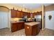 The kitchen features stainless steel appliances, a central island, and plenty of storage at 7653 Stoney Hill Dr, Wesley Chapel, FL 33545