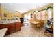 The eat-in kitchen features stainless steel sink, an eating area, and opens to the living room at 7653 Stoney Hill Dr, Wesley Chapel, FL 33545